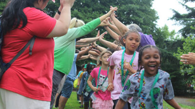 Kids running at grief camp